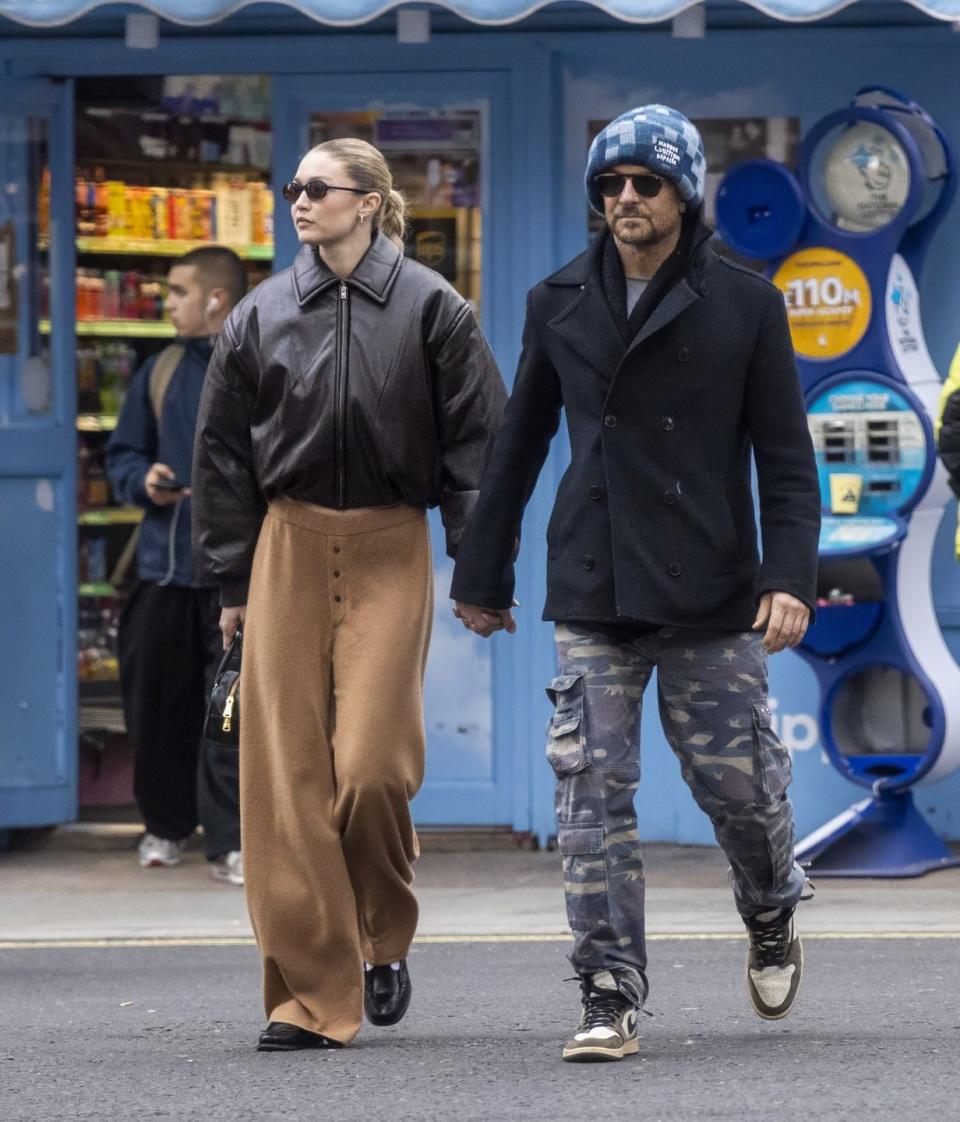 gigi and bradley walking down the street