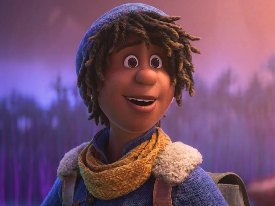 a young, biracial Black teenager in the animated film "Strange World." he has hair coming out from underneath a beanie, and wears small, golden hoop earrings. there's an earnest, eager expression on his face