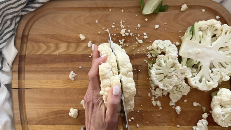 hand slicing cauliflower