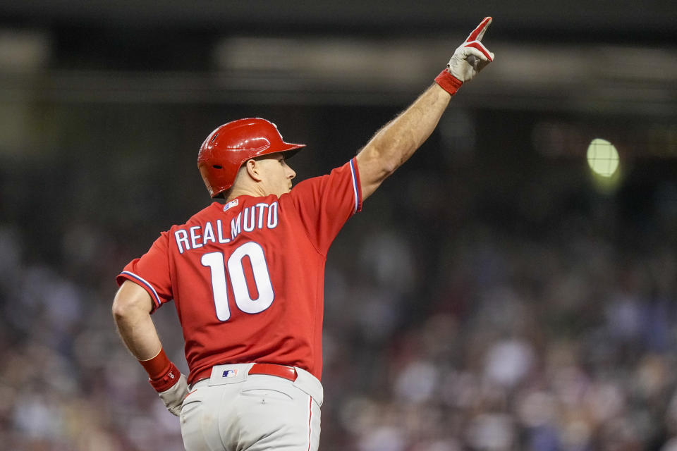 Philadelphia Phillies' J.T. Realmuto celebrates his two run home run against the Arizona Diamondbacks during the eighth inning in Game 5 of the baseball NL Championship Series in Phoenix, Saturday, Oct. 21, 2023. (AP Photo/Brynn Anderson)