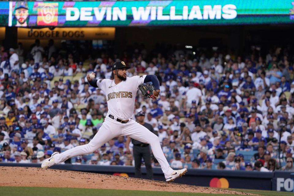 National League pitcher Devin Williams, of the Milwaukee Brewers, throws a pitch to the American League during the seventh inning of the MLB All-Star baseball game, Tuesday, July 19, 2022, in Los Angeles.