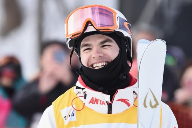 Olympic and world moguls champ, Mikael Kingsbury is urging Quebec Premier Francois Legault to allow organized sports to resume in schools. The freestyle skier believes that the absence of sports is affecting the mental and physical health of kids.  (Matt Roberts/Getty Images - image credit)