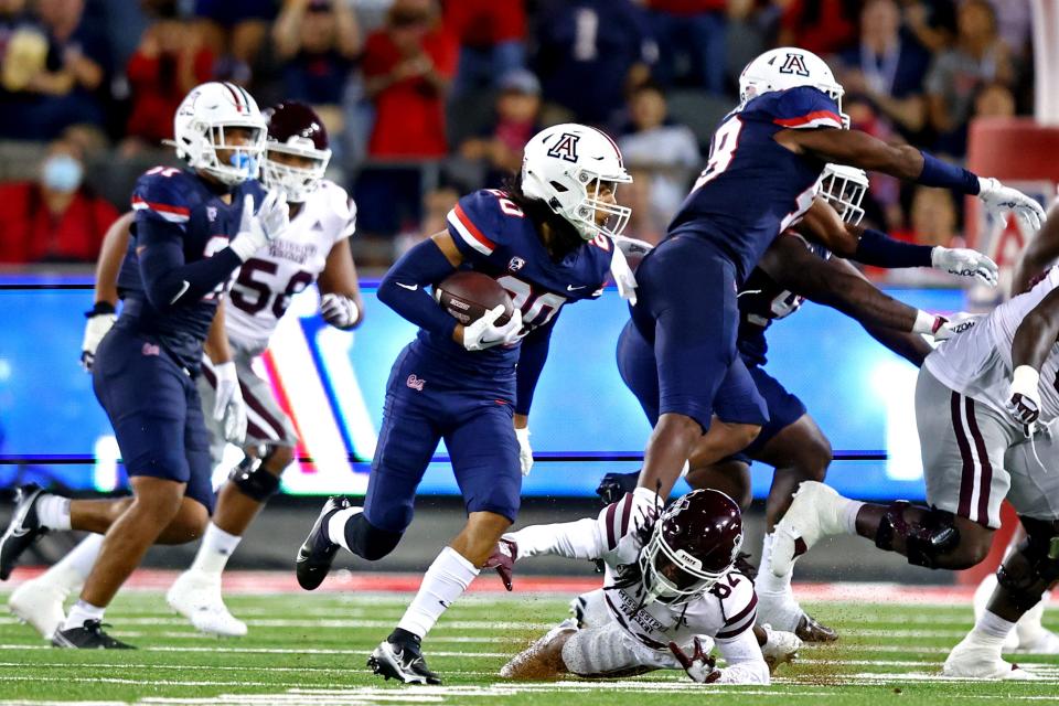 Sep 10, 2022; Tucson, Arizona, USA; Arizona Wildcats cornerback Treydan Stukes (20) intercepts a class intended for Mississippi State Bulldogs wide receiver Caleb Ducking (4) during the first half at Arizona Stadium.