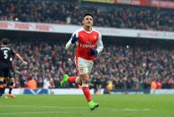 <p>Alexis Sanchez celebrates netting Arsenal’s second goal from the penalty spot</p>