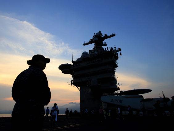 USS Carl Vinson docked in Vietnam. Stephen Kellogg served on board between 2016 to 2018 (AP)