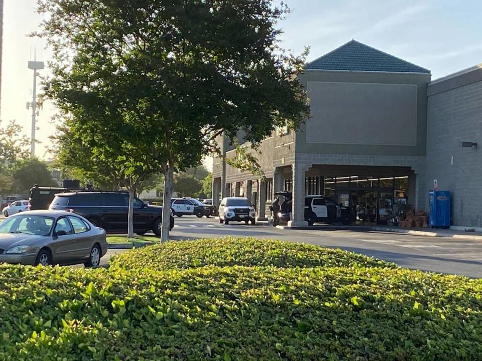 Fresno police at the scene of a standoff with a suspect barricaded inside the Save Mart grocery store near First Street and Nees Avenue on Friday morning, May 20.