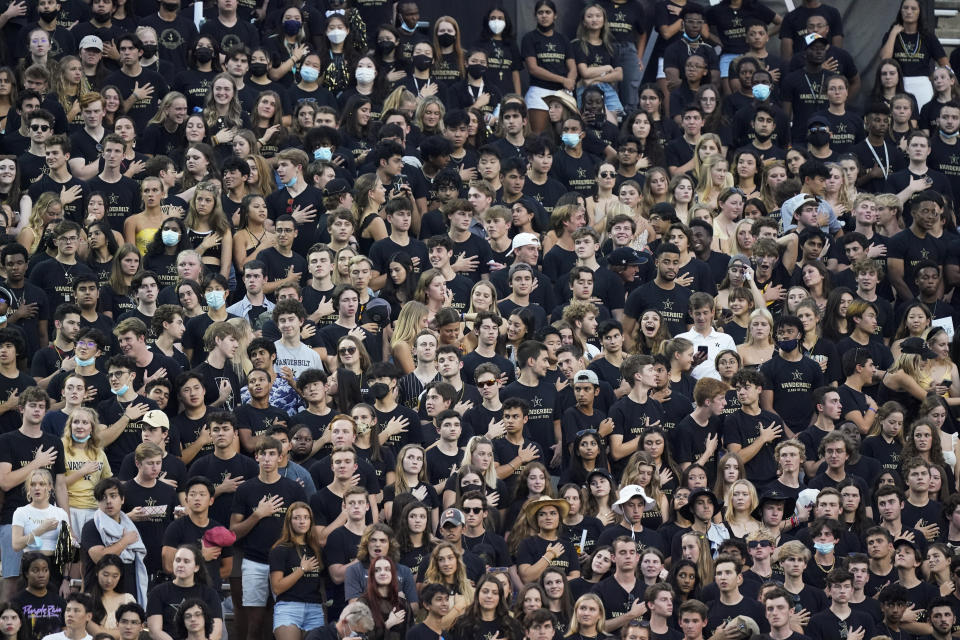 FILE - Vanderbilt students stand for the national anthem before an NCAA college football game between Vanderbilt and East Tennessee State Saturday, Sept. 4, 2021, in Nashville, Tenn. After statewide bans on affirmative action in states from California to Florida, colleges have tried a range of strategies to achieve a diverse student body – giving greater preference to low-income families and admitting top students from communities across their states. But after years of experimentation, some states requiring race-neutral policies have seen drops in Black and Hispanic enrollments.(AP Photo/Mark Humphrey, File)