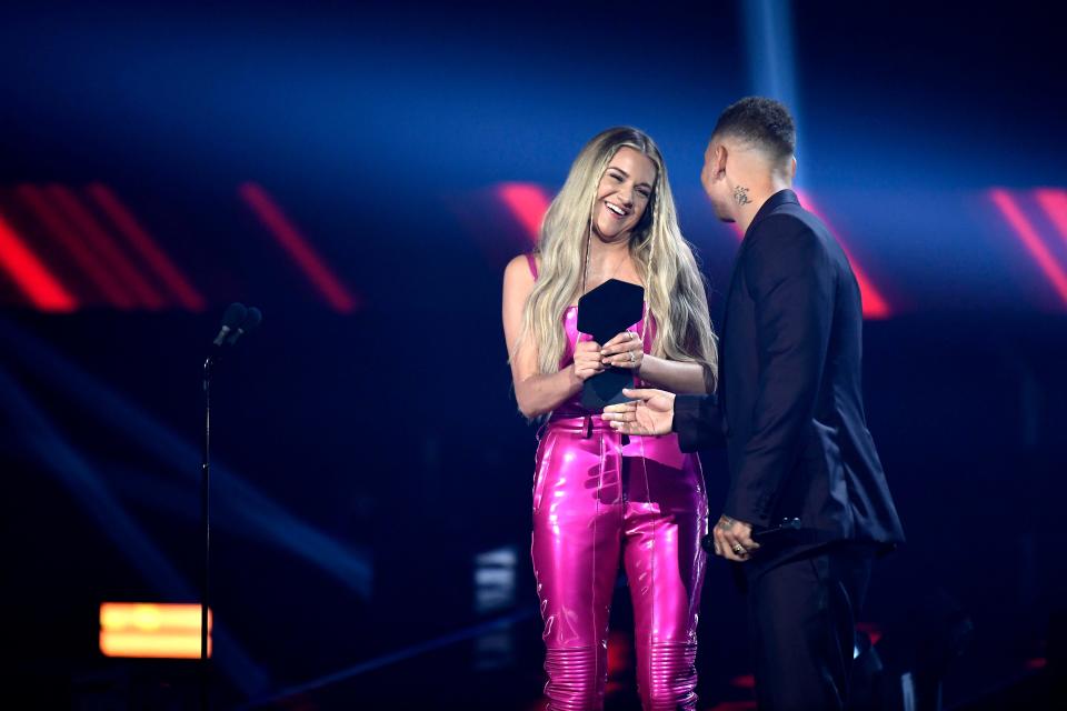 Kelsea Ballerini accepts the award for Performance of the Year from Kane Brown during the 2021 CMT Music Awards at Bridgstone Arena in Nashville, Tenn, on Wednesday, June 9, 2021.