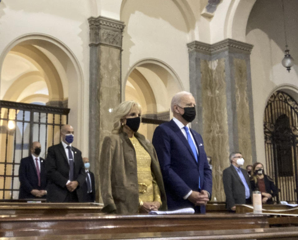 U.S. President Joe Biden and and first lady Jill Biden attend mass at St. Patrick's Church during the G20 leaders summit, Saturday, Oct. 30, 2021, in Rome. (AP Photo/Nicole Winfield)