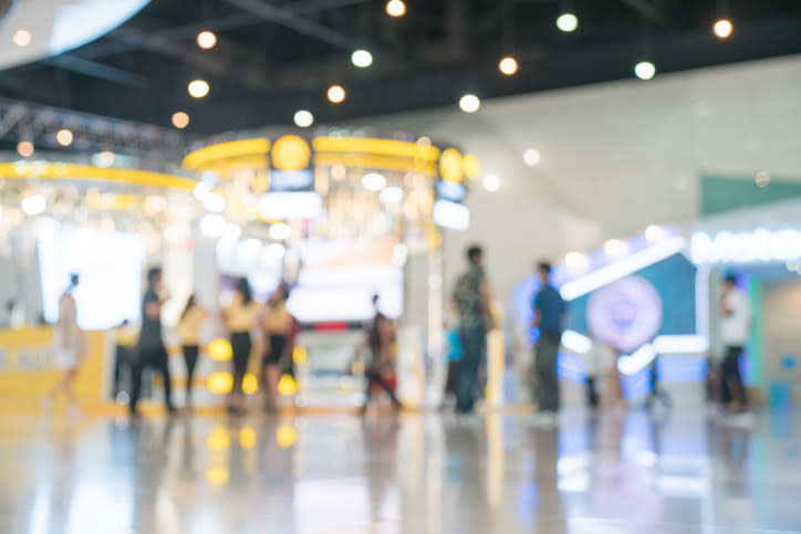 A blurry view of a crowded shopping mall