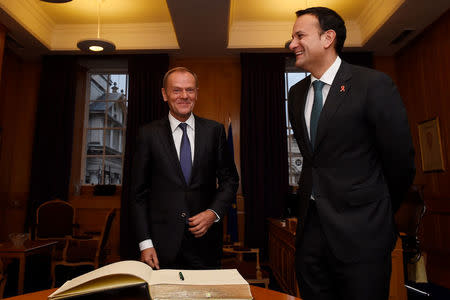 President of the European Council Donald Tusk signs a guest book in the office of Prime Minister (Taoisaech) of Ireland Leo Varadkar at Government buildings in Dublin, Ireland, December 1, 2017. REUTERS/Clodagh Kilcoyne