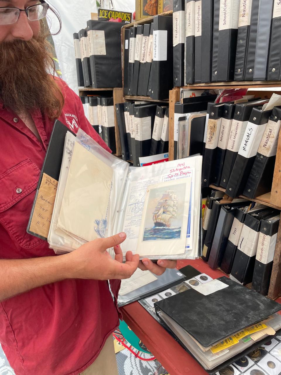 Ephemerals - pamphlets, manuals, postcards, organized into binders and divided by category, shown by Ryan Ward, of Past Cache LLC, Quaker Acres. Some individual items go for as much as $200