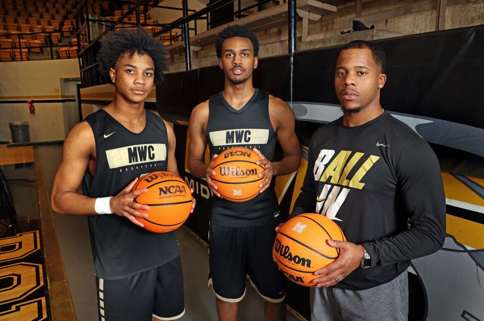 Midwest City High School former basketball player and current head coach Torey Noel with players Carlsheon Young and Roy Henderson on Jan 29, 2024; MWC, Okla, [ENTER COUNTRY]; at Midwest City High School Gymnasium. Mandatory Credit: Steve Sisney-The Oklahoman