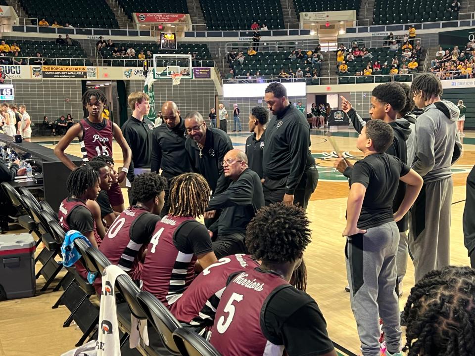 Harvest Prep coach David Dennis Sr. speaks to his team during the Warriors' 78-48 regional semifinal win over North Adams on Wednesday.