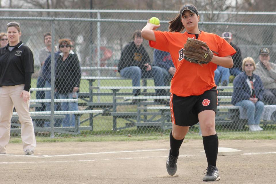 Gibsonburg's Sarah Gruner throws to first base for an out.
