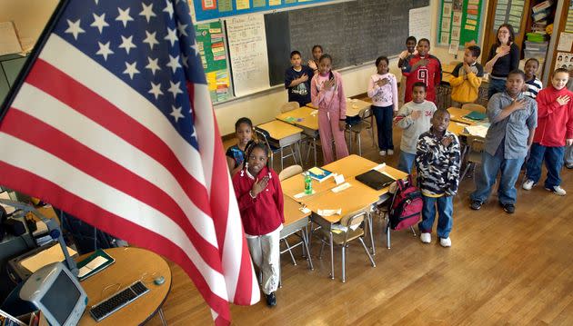 Fourth graders at Charles H. Taylor Elementary School in Boston recite the Pledge of Allegiance on March 24.