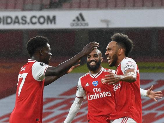 Saka, Lacazette and Aubameyang celebrate (Getty)