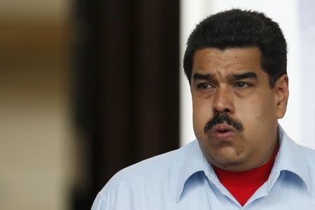 Venezuela's President Nicolas Maduro gestures while he attends to a rally against the opposition's amnesty law at Miraflores Palace in Caracas, April 7, 2016. REUTERS/Carlos Garcia Rawlins