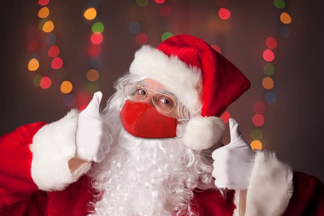 Santa Claus gives two thumbs up, assumedly to the idea of celebrating Christmas safely this year. 