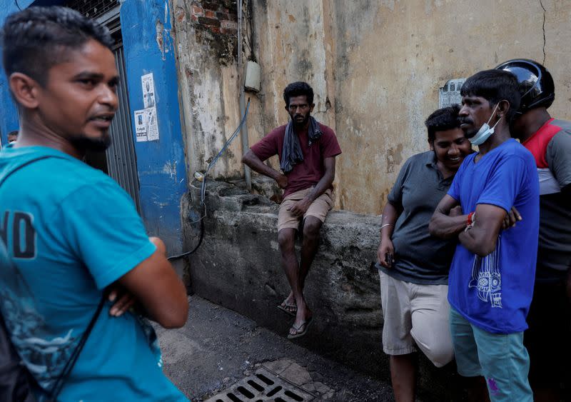 FILE PHOTO: Workers are seen at a closed essential food store during a nationwide strike demanding the resignation of President Goatabaya Takapaksa and his cabinet, in Colombo