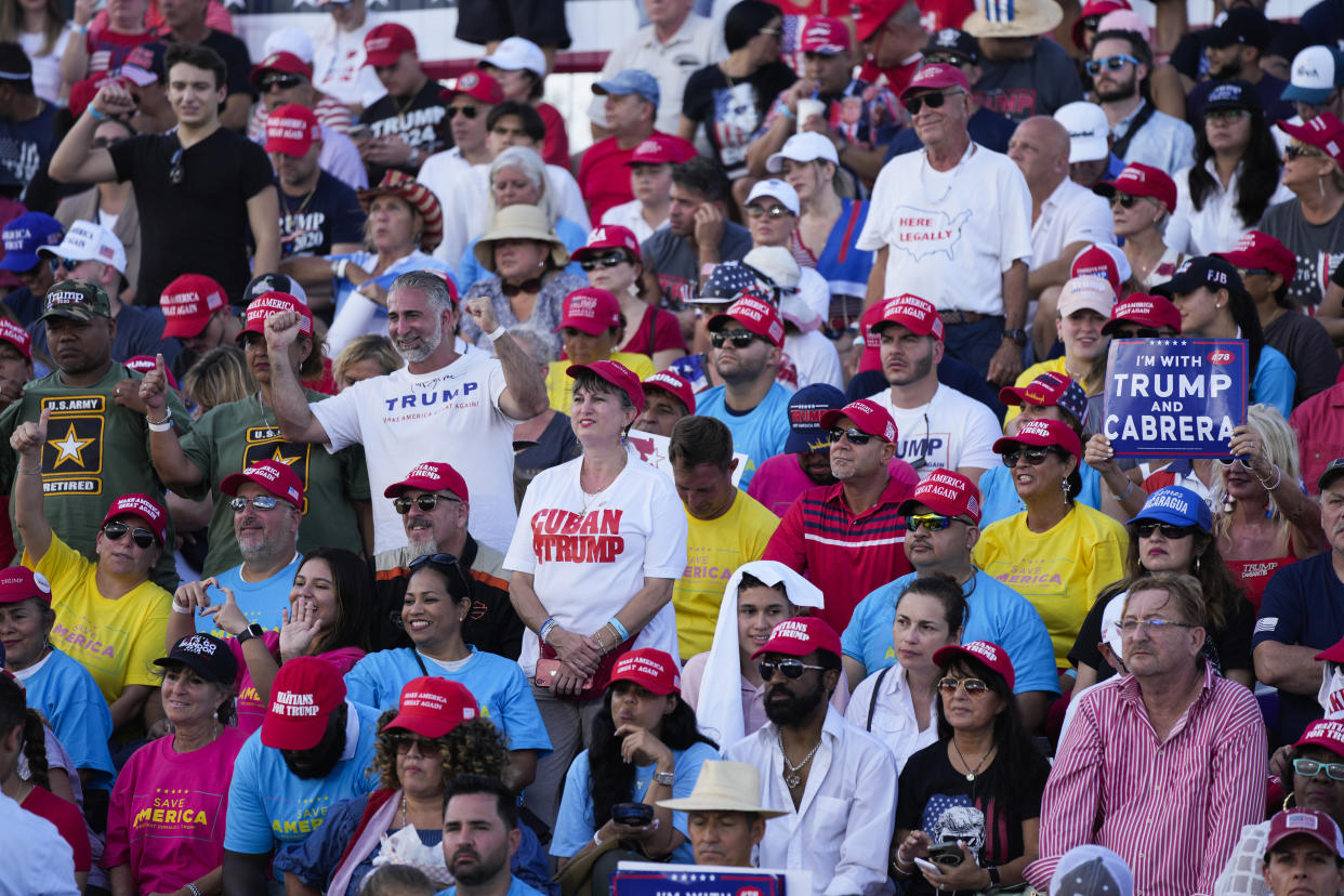 People in the crowd, many wearing Make America Great Again caps, at a rally where Donald Trump was set to speak.