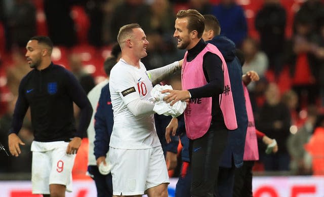 Wayne Rooney, left, celebrates with Harry Kane 