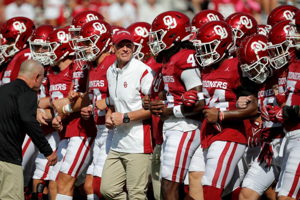 Oklahoma coach Brent Venables walks with his team before a college football game between the University of Oklahoma Sooners (OU) and the Arkansas State Red Wolves at Gaylord Family-Oklahoma Memorial Stadium in Norman, Okla., Saturday, Sept. 2, 2023.