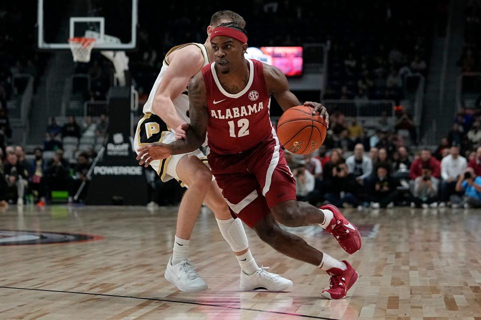 Dec 9, 2023; Toronto, Ontario, CAN; Alabama Crimson Tide guard Latrell Wrightsell Jr. (12) drives to the basket against the Purdue Boilermakers during the first half at Coca-Cola Coliseum. Mandatory Credit: John E. Sokolowski-USA TODAY Sports