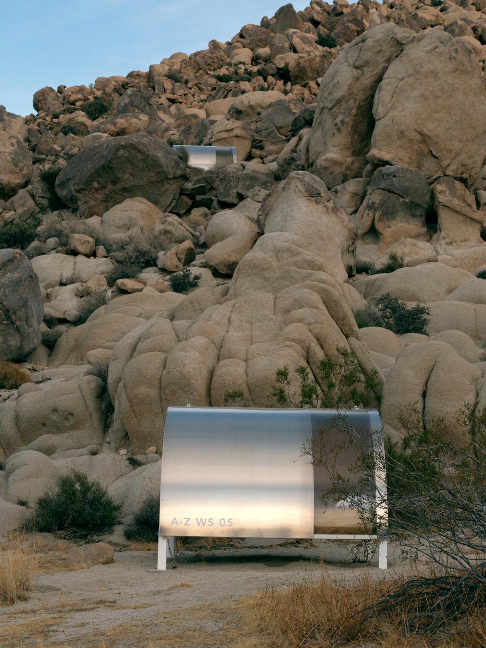 The “Wagon Station Encampment” is an array of twelve hard-shelled portable structures that sit above a wash near Zittel’s home. Originally conceived as a way to host collaborators visiting Joshua Tree, Zittel opened them to bi-seasonal artists-in-residence from 2011 to 2017. Tent-like in size, their design and name play on both the covered wagon and the station wagon.