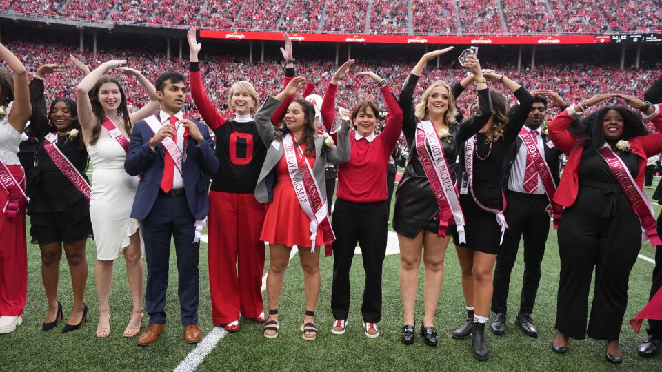 Ohio State University President Kristina Johnson celebrates the 2022 Homecoming court before the football game between the Buckeyes and the Rutgers Scarlet Knights at Ohio Stadium in October.