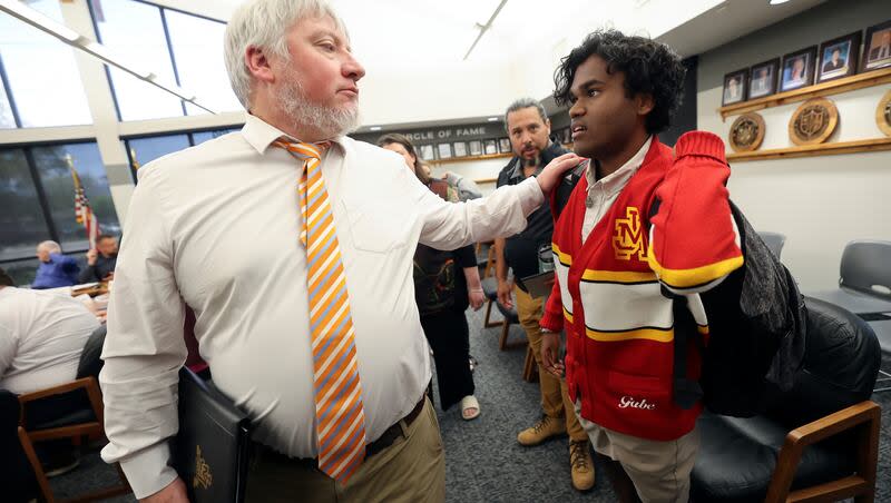 Judge Memorial Catholic High School principal Patrick Lambert acknowledges Gabe Ambrose, a Judge Memorial senior lacrosse player from Malaysia, after the Utah High School Activities Association executive committee voted to restrict F-1 visa student athlete participation during a meeting at UHSAA headquarters in Midvale on Wednesday, May 1, 2024.