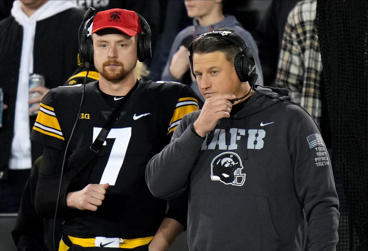 Iowa quarterback Spencer Petras, left, and offensive coordinator Brian Ferentz look on as the Hawkeyes offense drives the ball in the third quarter against Nebraska during an NCAA football game on Friday, Nov. 25, 2022, at Kinnick Stadium in Iowa City.