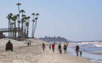 SAN CLEMENTE, CA - MAY 05: Visitors walk on the beach south of the pier in San Clemente, CA on Tuesday, May 5, 2020. The city opened its beaches for daily active use after coordinating with Gov. Gavin Newsom"u2019s office to maintain social distancing during the COVID-19 (coronavirus) lockdown. (Photo by Paul Bersebach/MediaNews Group/Orange County Register via Getty Images)