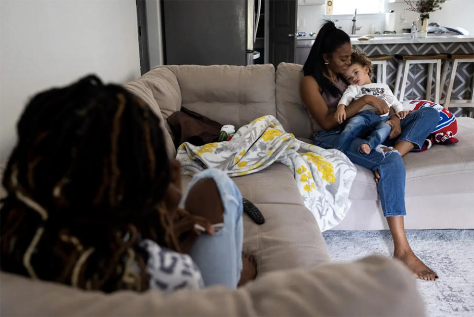 Brittany Henson spends time with her son Leo and daughter Bremyiah at their home in Hemphill on Dec. 30, 2022. She’s raising her children in the town where generations of her family have lived and worked. (Annie Mulligan / The Texas Tribune)