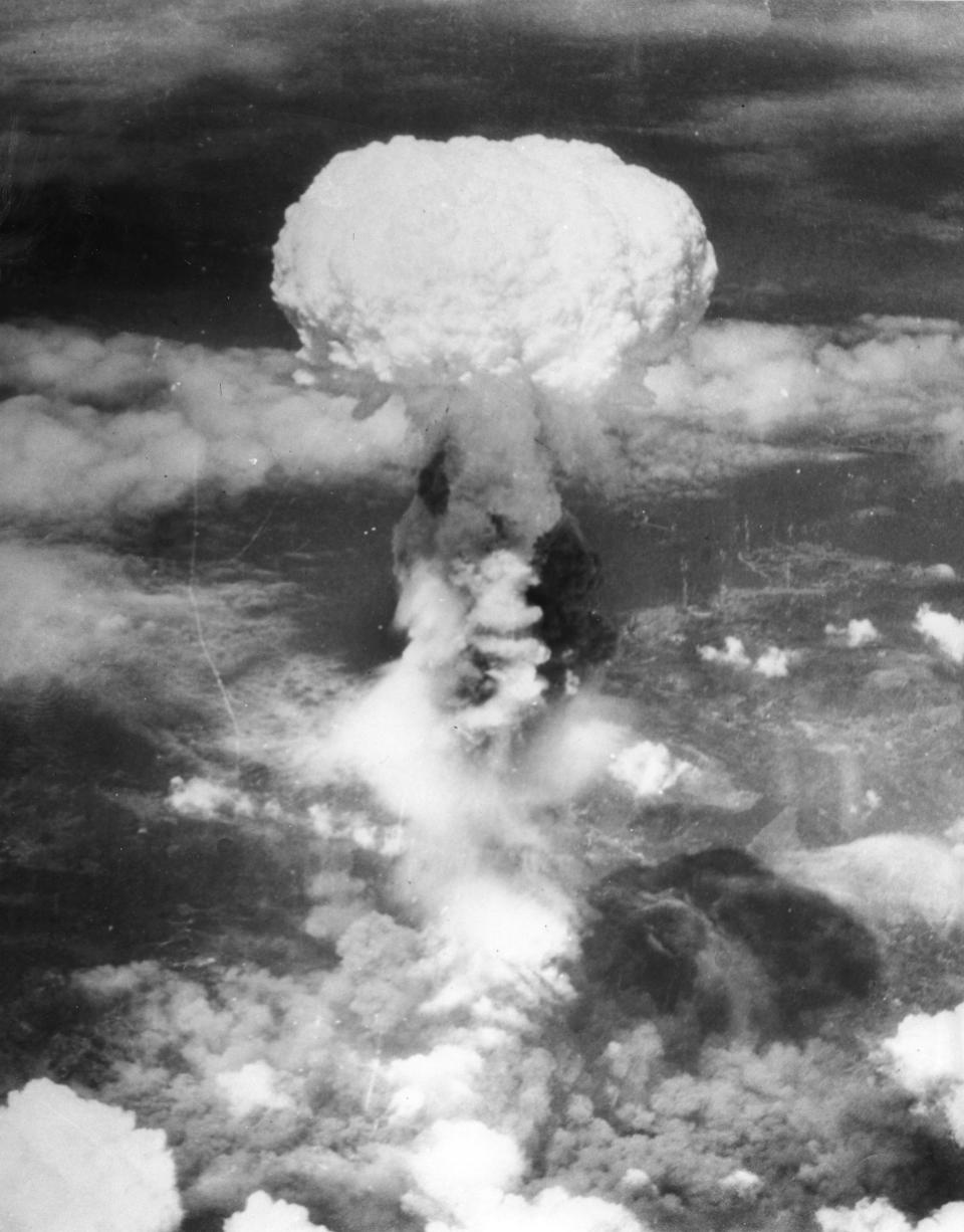 FILE - In this Aug. 9, 1945, file photo, a giant column of smoke rises more than 60,000 feet into the air, after the second atomic bomb ever used in warfare explodes over the Japanese port town of Nagasaki, dropped by the U.S. Army Air Forces B-29 plane "Bockscar." The U.S. dropped a uranium bomb on Hiroshima on Aug. 6, 1945, killing 140,000 people in the world's first atomic attack. Three days later, it dropped a plutonium bomb on Nagasaki, killing another 74,000. (AP Photo, File)