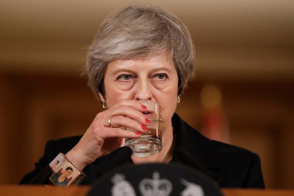 The PM sips water during a press conference in Downing Street (AP)