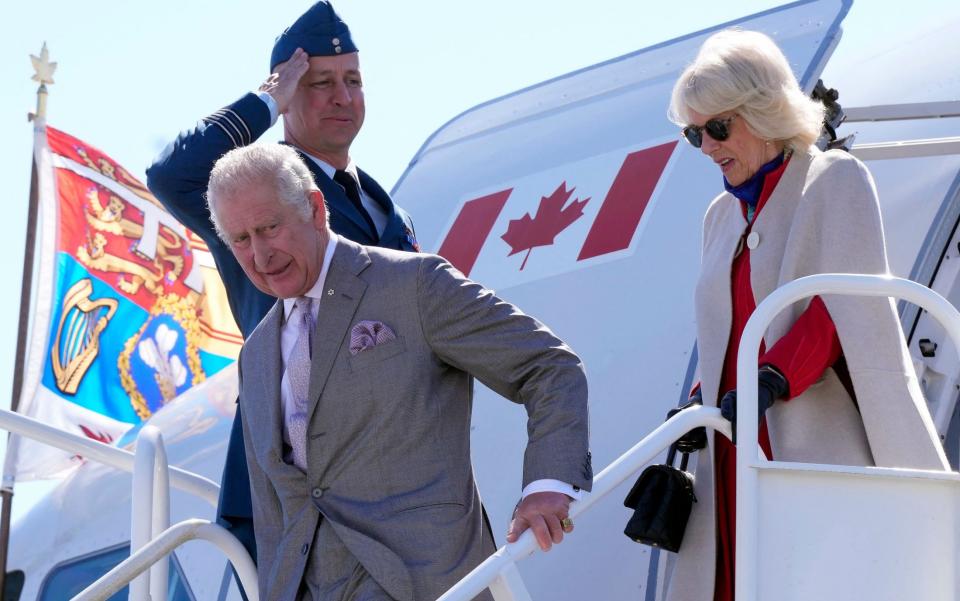 The Prince of Wales and the Duchess of Cornwall getting off a plane after a flight to Canada. The Prince took more than 20 private flights within the UK last year - Paul Chiasson/AFP via Getty Images