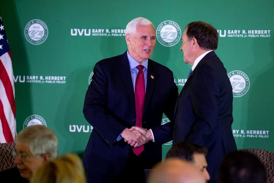 Former Vice President Mike Pence shakes hands with former Gov. Gary Herbert at an event at the Zions Bank Building in Salt Lake City on Friday, April 28, 2023. The event was hosted by the Gary R. Herbert Institute for Public Policy at Utah Valley University. | Spenser Heaps, Deseret News