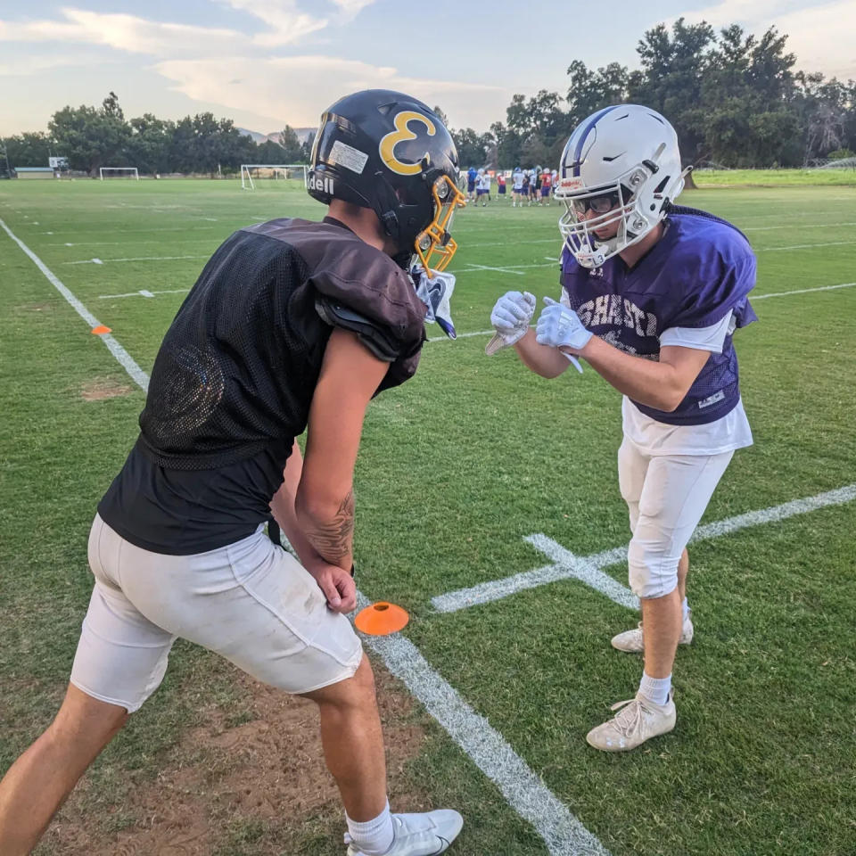 Rivals in opposing jerseys but now teammates, Enterprise graduate Holden Matthews (left) and Shasta High School graduate Zach Schuette (right) drill one another at Shasta College in preparation for the 46th Lions All Star game on Tuesday, June 13, 2023.