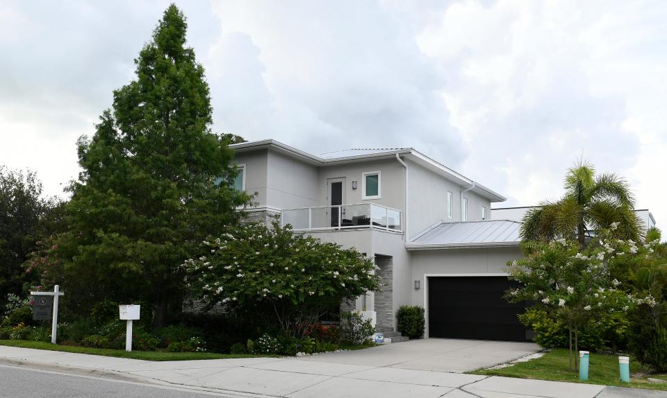 Realtor Ray Collins with Coldwell Banker is representing the sellers of this four-bedroom, three-bathroom house in The Homes of Laurel Park. He calls the 2,698-square-foot home, which is listed at $2.2 million “luxury on the cusp of downtown.”