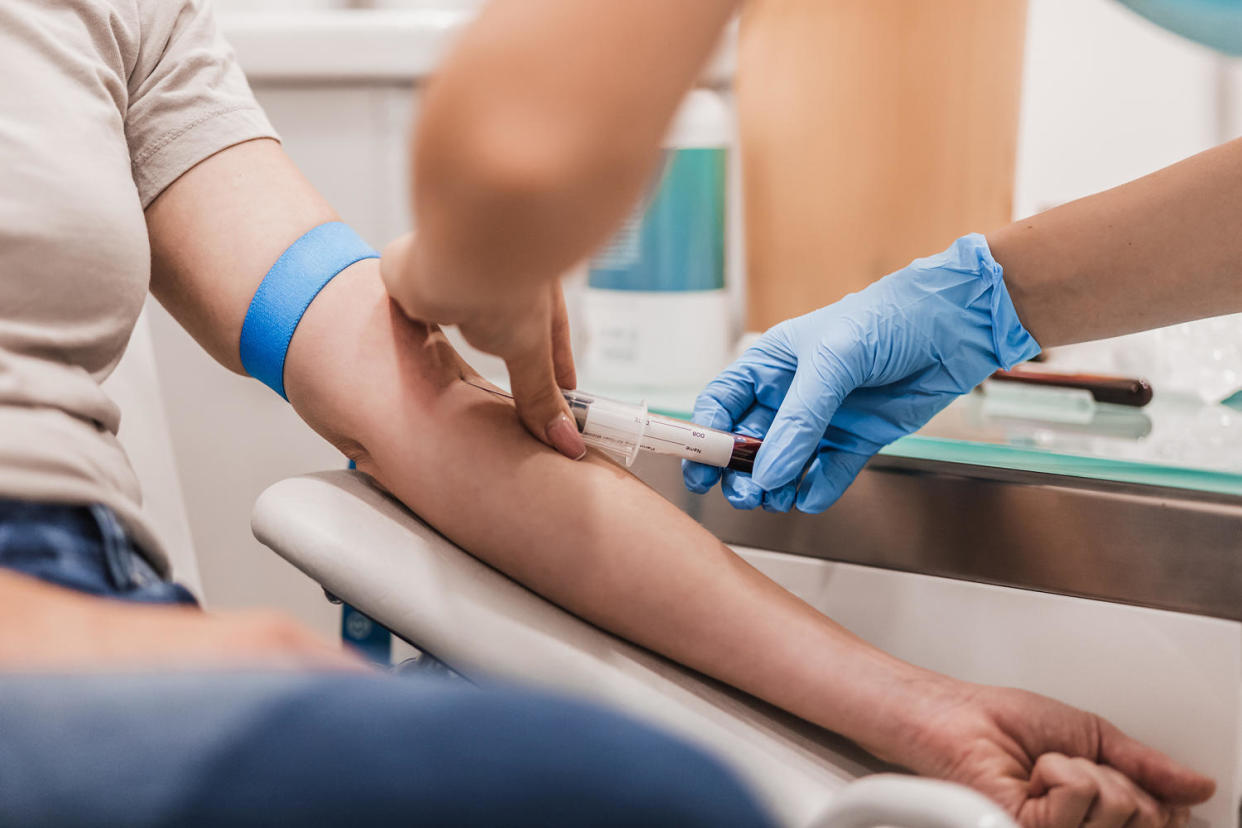 Close-up Of Doctor Taking Blood Sample From Patient's Arm in Hospital for Medical Testing. (Getty Images)