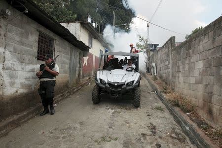 City health workers fumigate the Guadalupe community as part of preventive measures against the Zika virus and other mosquito-borne diseases in Santa Tecla, El Salvador February 3, 2016. REUTERS/Jose Cabezas -