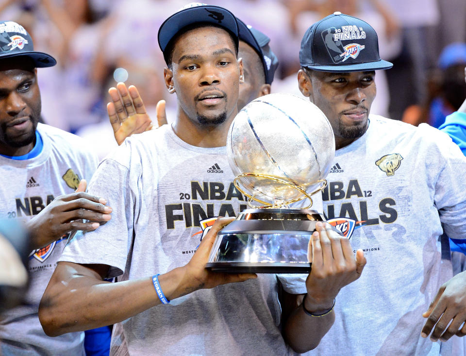 Kevin Durant of the Oklahoma City Thunder celebrates with the trophy after defeating the San Antonio Spurs to win the Western Conference Finals of the 2012 NBA Playoffs at Chesapeake Energy Arena on June 6, 2012 in Oklahoma City, Oklahoma. (Photo by Michael Heiman/Getty Images)