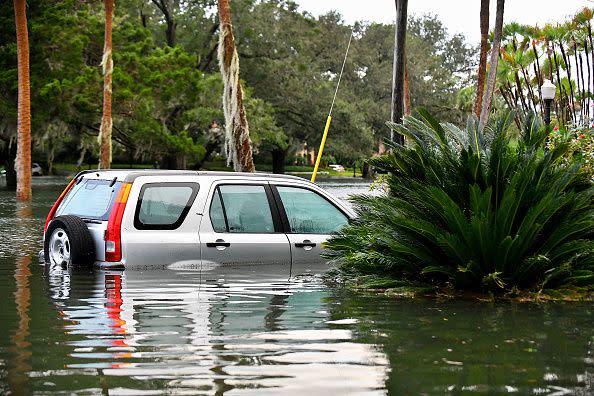 A car sits in floodwater after Hurricane Ian on September 29, 2022, in Orlando, Florida.