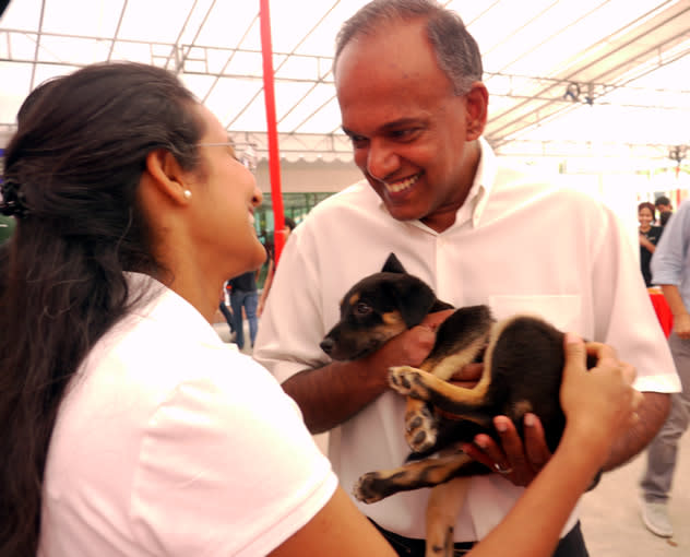 Law minister K Shanmugam, together with his wife, decides to bring home this rescued puppy after an animal welfare forum on Saturday. (Yahoo! photo)