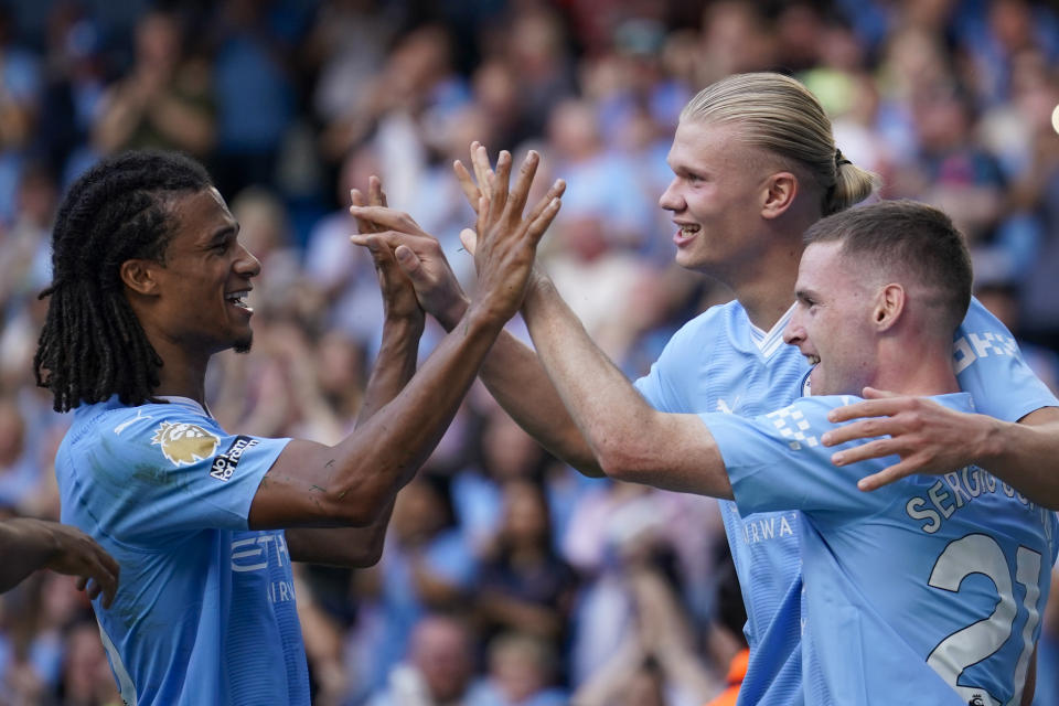 Manchester City's Erling Haaland, second right, celebrates with teammates after scoring his side's fifth goal during the English Premier League soccer match between Manchester City and Fulham at the Etihad stadium in Manchester, England, Saturday, Sept. 2, 2023. (AP Photo/Dave Thompson)