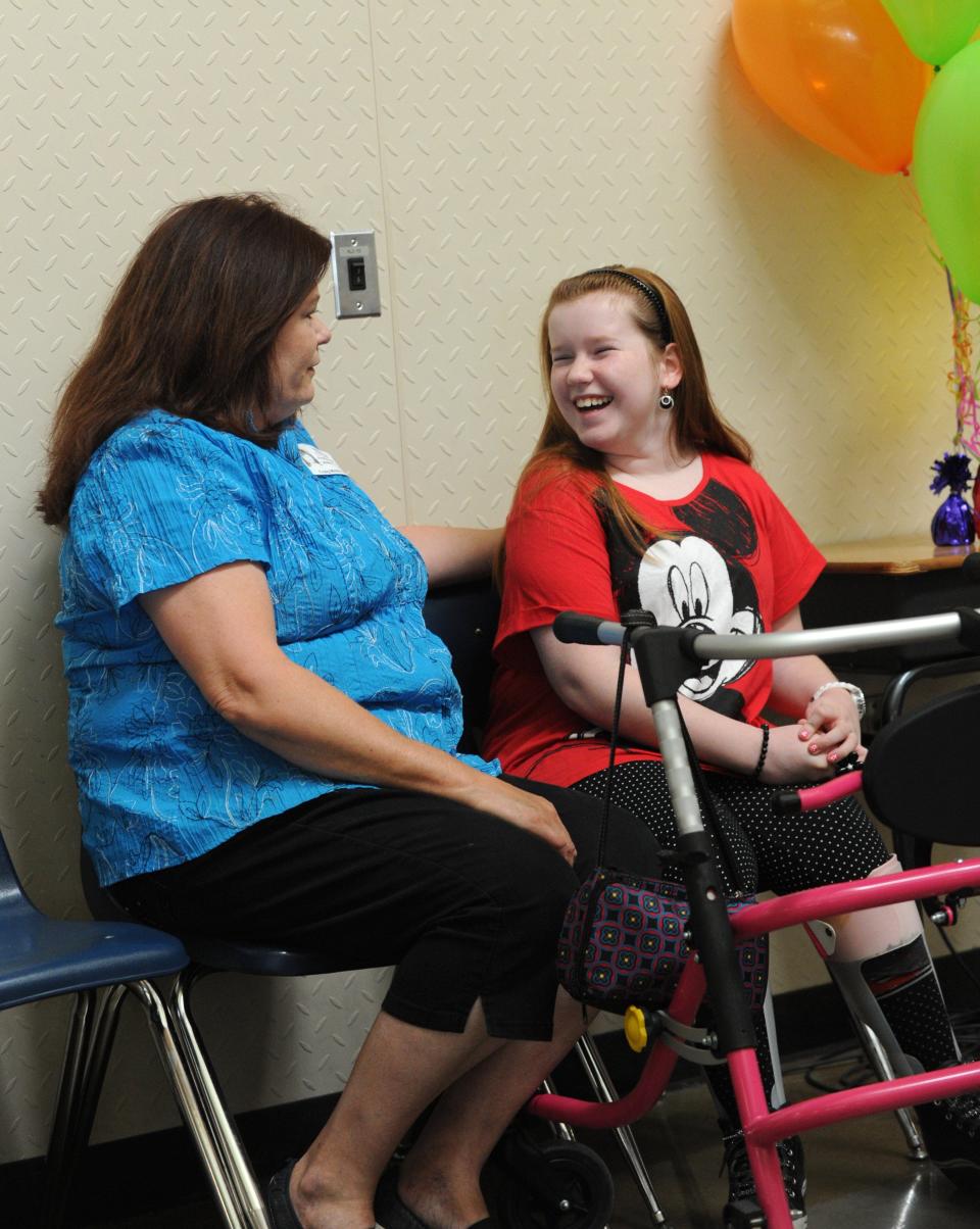 Craig Middle School student Breanna Hodges, right, with her mother, Fransuelle, in 2013, when Breanna earned a trip to Disney World. Ten years later, Breanna is a college graduate.