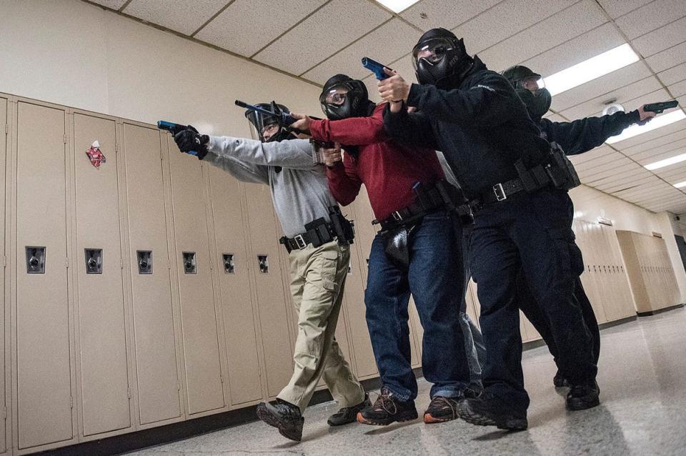 Plymouth Township police officers participate in a simulated active shooter during training at the Plymouth Arts and Recreation Complex in Plymouth in Jan., 2017.