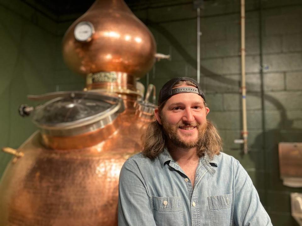 Co-owner Will Robinson with “Big Richard,” a copper alembic still, at Longleaf Distillery opening soon in downtown Macon.