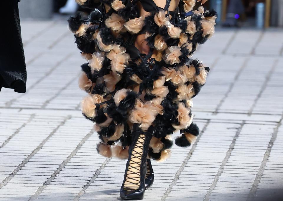 A closer look at the black strappy boots worn by Katy Perry at Vogue: World in Paris